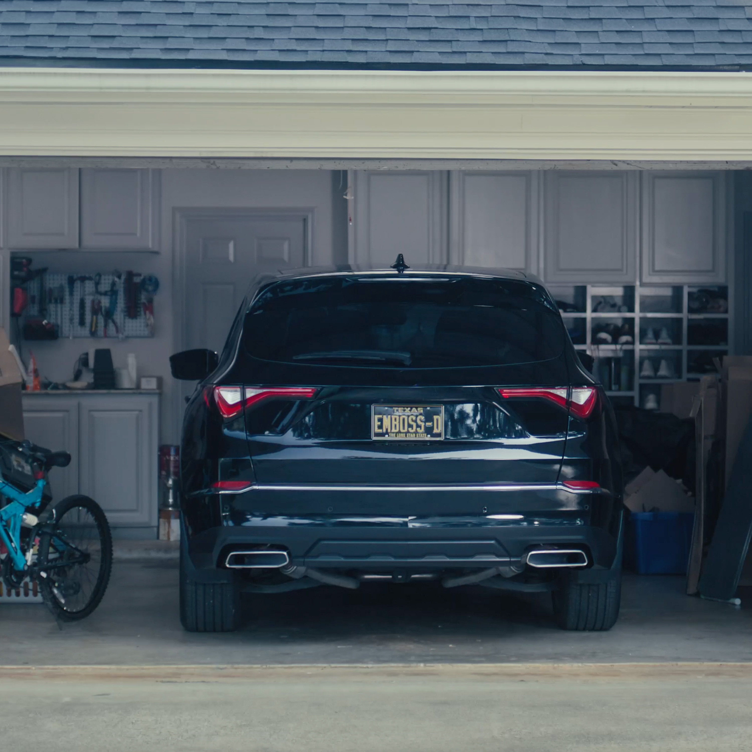 Still of car with Embossed license plate from garage renovation spot